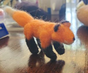 red fox with black ear tips and black feeties